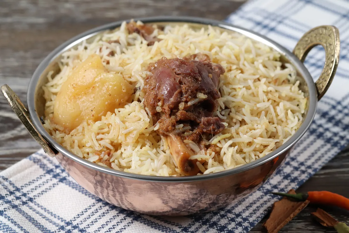 Authentic Kacchi Biryani - Sagar Restaurant's signature dish with fragrant basmati rice and tender meat